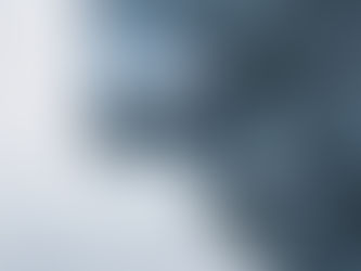 Close-up of an ice-covered face with a melting drop of water forming beneath the nose.
