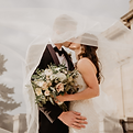 Couple at their wedding which is being held in a marquee