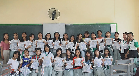 Group of school children receiving their free period knickers from ByFullstop