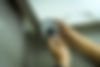Hand holding a screwdriver installing CCTV camera