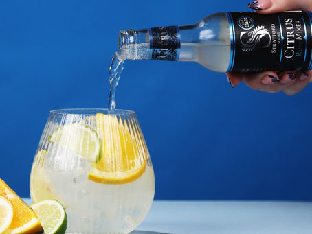 Stratford Sodas citrus mixer being poured into glass.