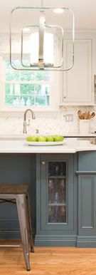 This sleek kitchen includes touch-activated faucets, energy-efficient lighting, and smart appliances. The new tile flooring and quartz countertops combine style and practicality for a modern family kitchen.