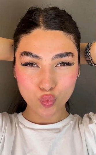 Close-up of Hadis making a kissy face