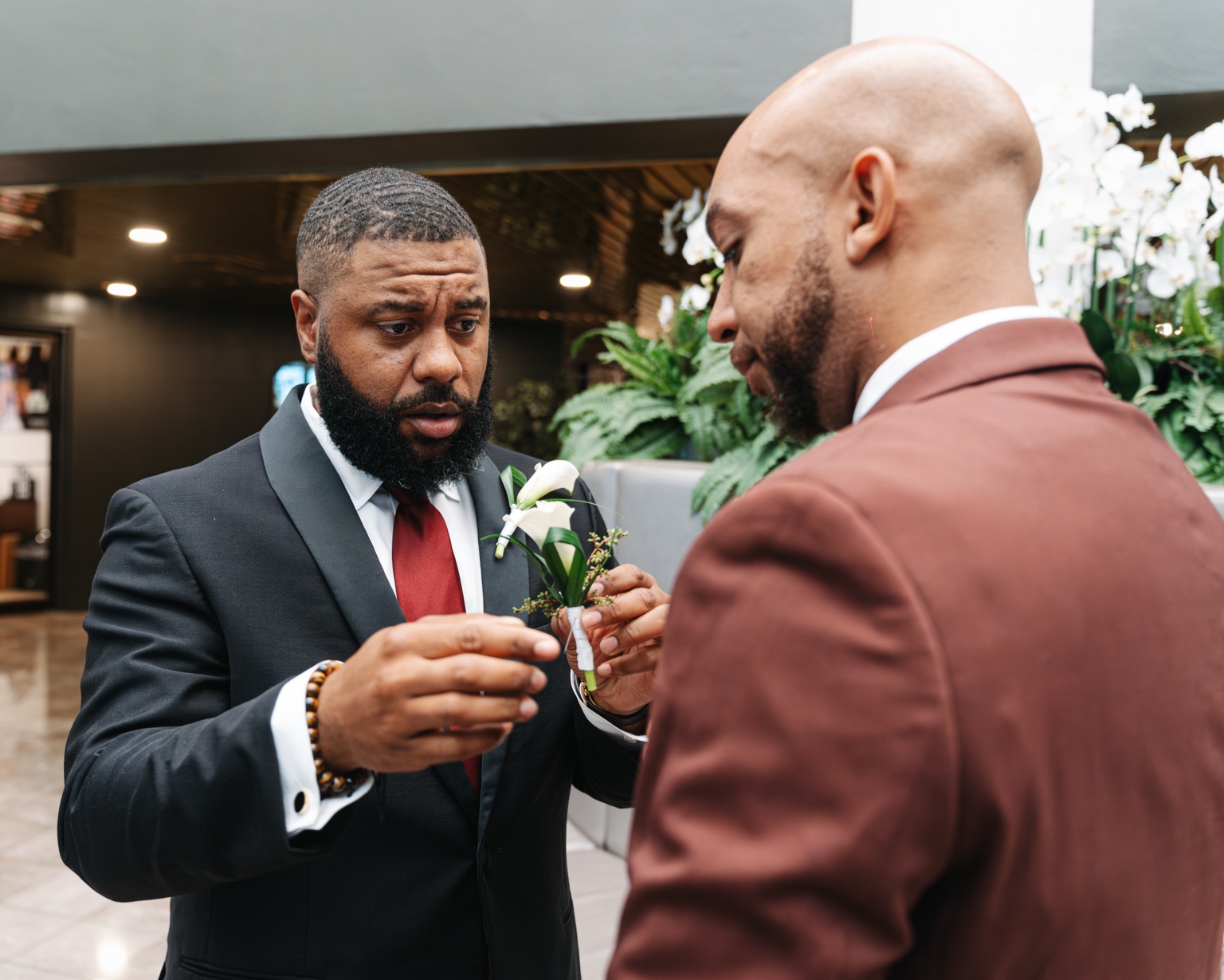 Evan having his boutonniere adjusted.