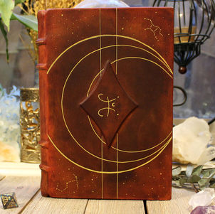 Brown leather bound journal with gold accents