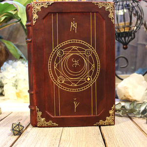 Brown leather bound journal with gold accents