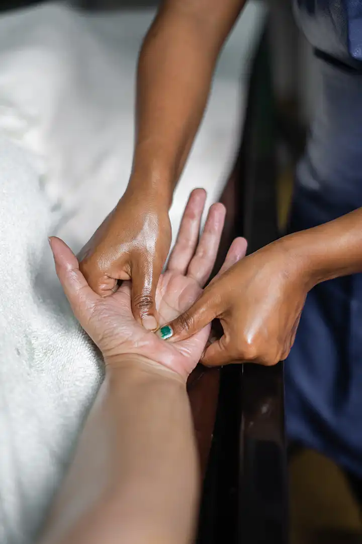 Woman enjoying ayurveda massage at yoga retreat conducted by satvan yoga, goa