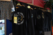 WhiteHart branded T shirts hanging on a rail