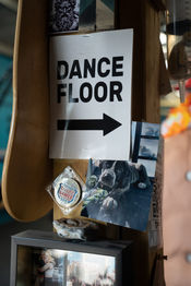 Dance Floor sign with an arrow