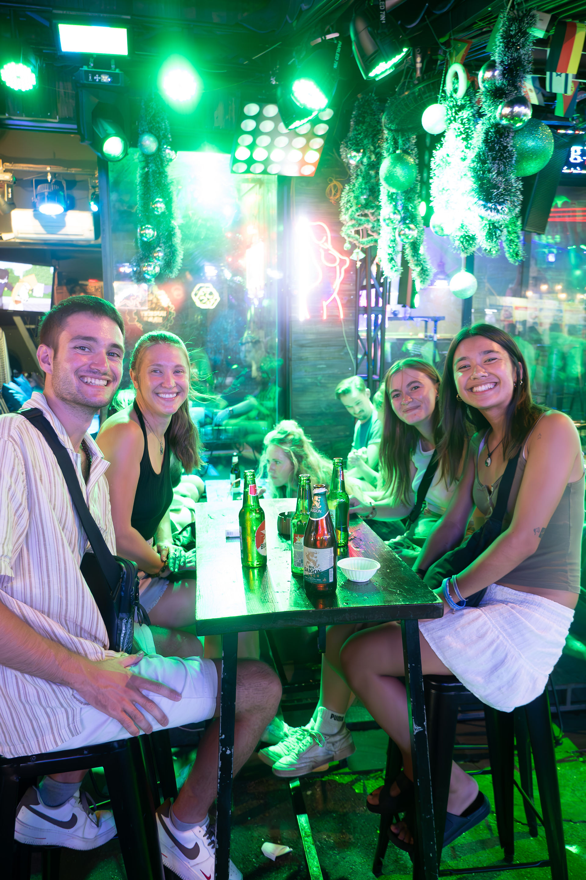 solo traveler making friends on a night out partying