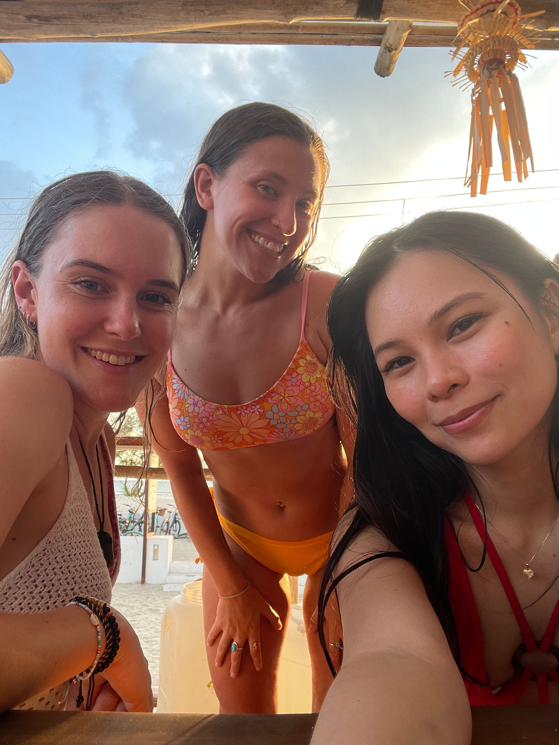 3 girls at the beach taking a selfie