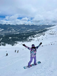 woman snowboarding at steamboat