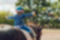 Girl riding a horse.jpg