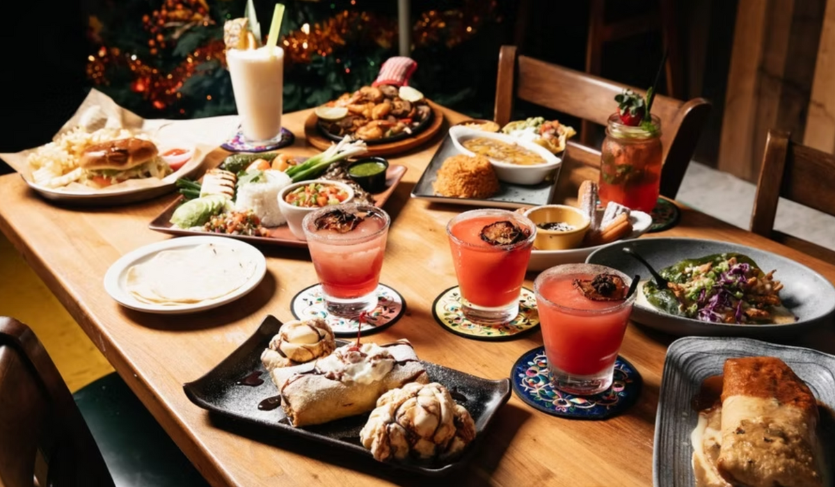 A table of Mi Mamacita's fajitas, entrees, desserts and margaritas