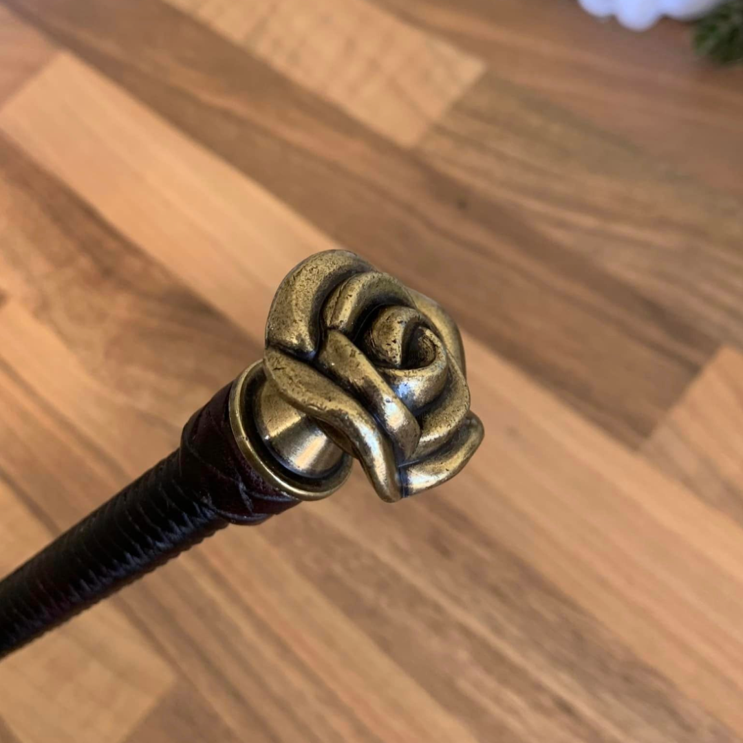 Rosie is a braided leather cane with rose shaped topper