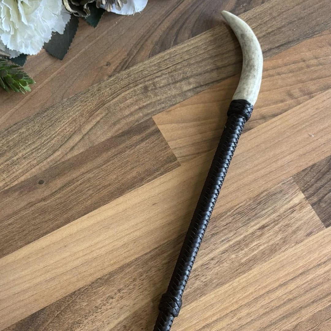 Athena is a braided leather cane with an antler tip.
