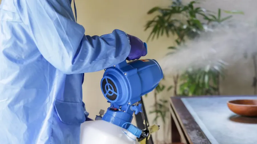 Image: Expert Pest Treatment in Action. Depiction of a Termike Pest Control professional actively treating pests while utilizing recommended equipment. The image captures the skilled employee's dedication to effective pest management, highlighting the company's commitment to utilizing the right tools for precise and thorough treatment.