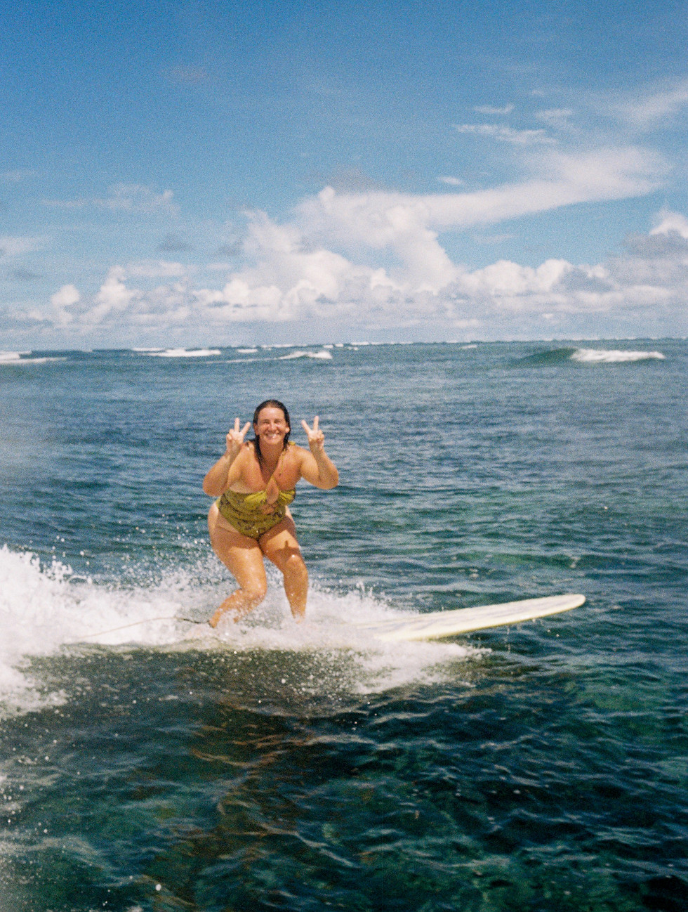 Sunshine Surf Sessions photographer surfing in Siargao, Philippines