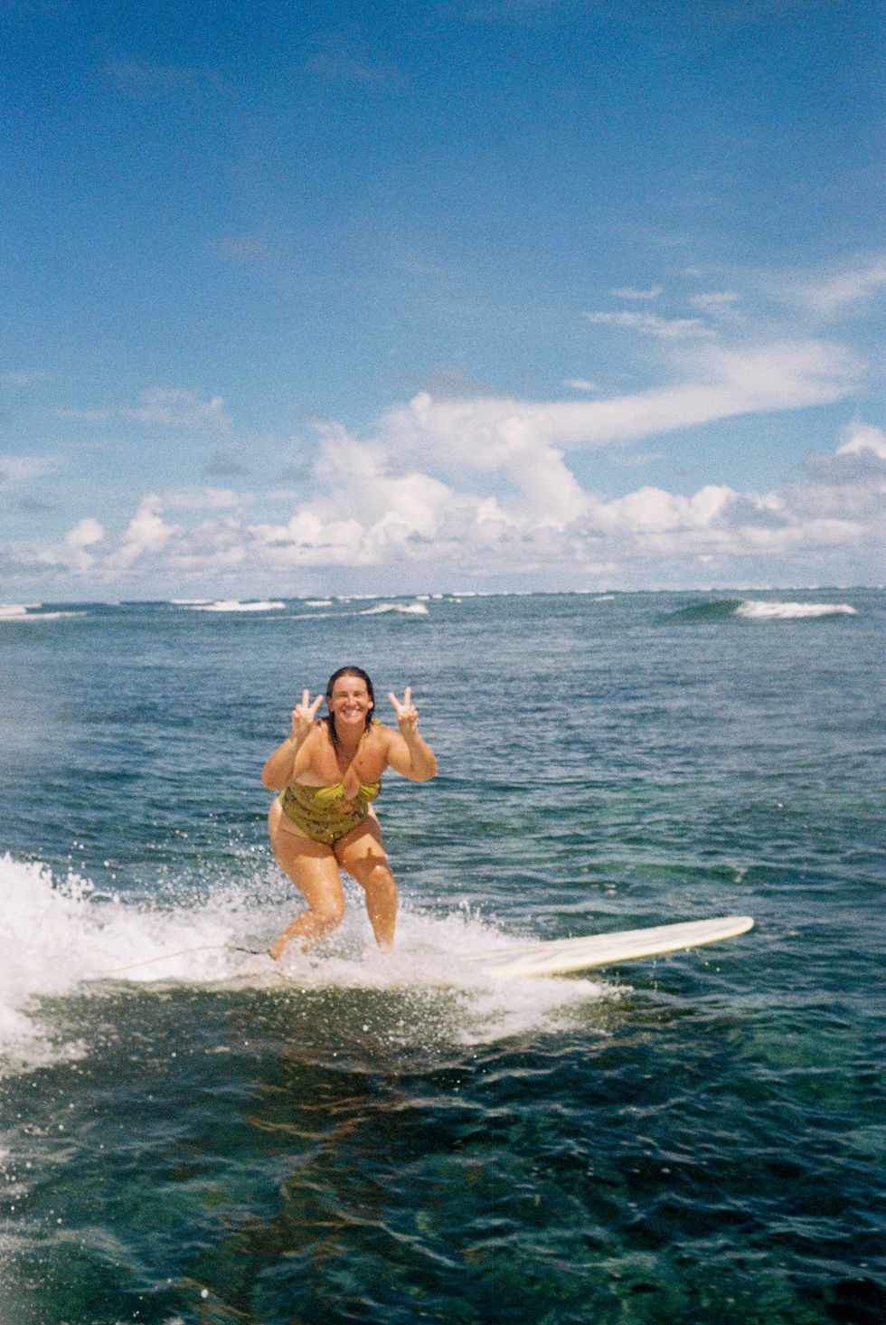 Sunshine Surf Sessions photographer surfing in Siargao, Philippines