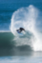 Surfer doing a cutback on a large wave in Newcastle, Australia