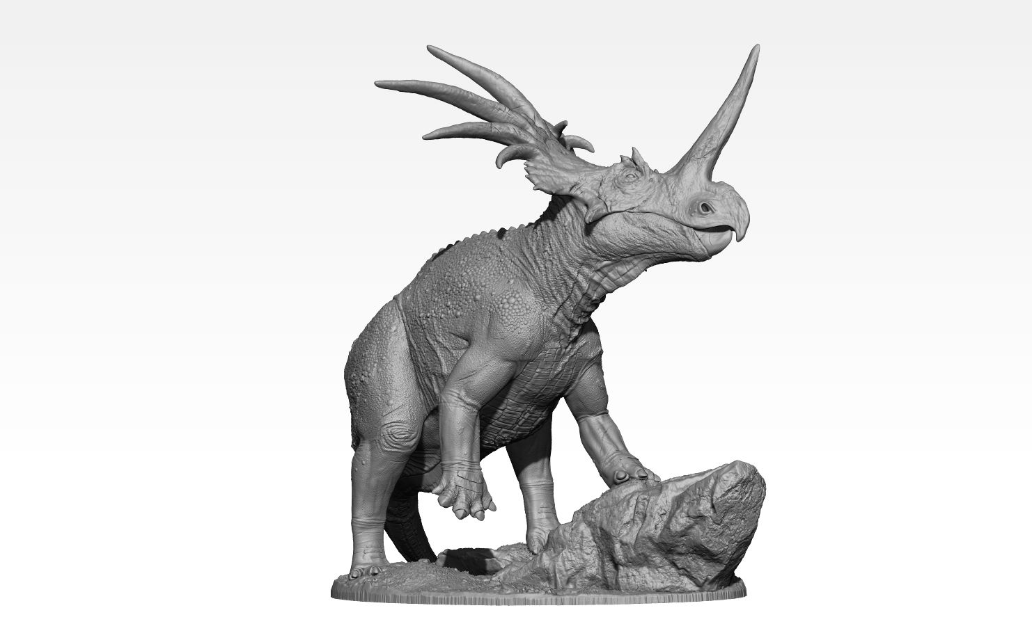Model of accurate realistic Styracosaurus dinosaur  purched on a rock.
