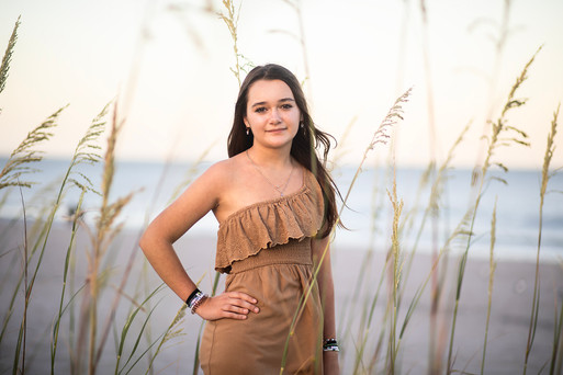 13 year old poses in tall grass at cocoa beach, fl