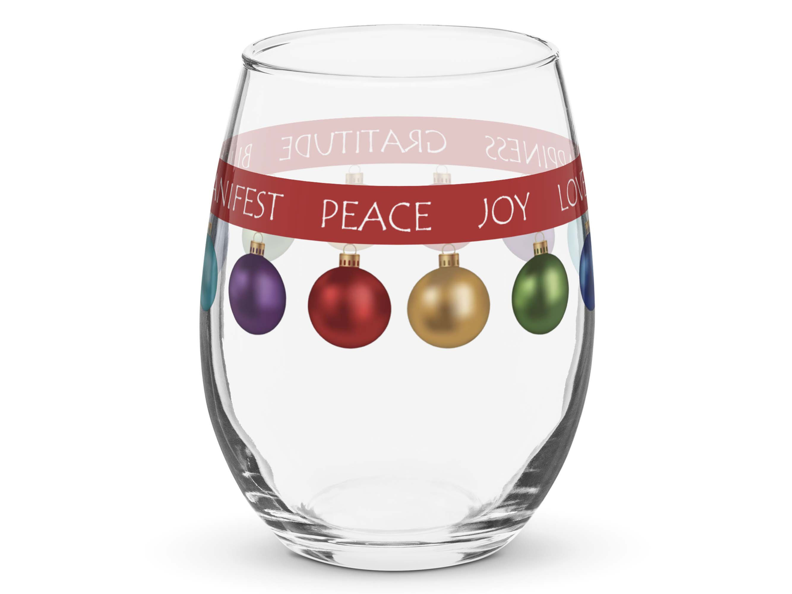 15oz stemless wine glass. Colorful design, Christmas balls and words “Manifest, Peace, Joy, Love, Happiness, Gratitude, Bliss