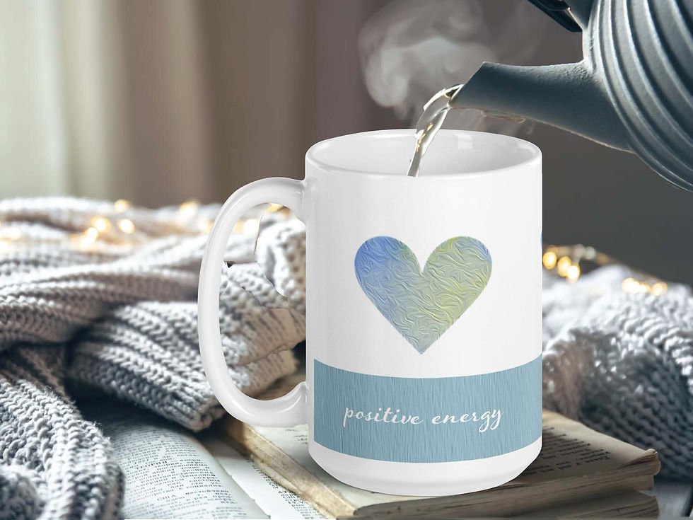 Thumbnail: A stone tea pot is pouring steaming tea into a Light and Love coffee mug surrounded by a comfy knitted blanket.