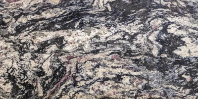 Texturerad granit med svarta, vita och beige toner. Bänkskivor i granit till ditt kök.