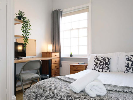 A bedroom in Seymour Terrace by Serviced Living Liverpool