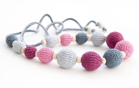 Beaded necklace may distract a baby from feeding