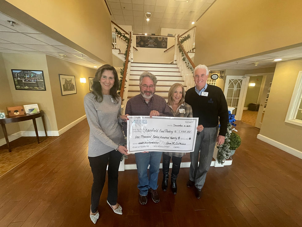 Pictured from left to right: Susan Jeffries, Director of Community Relations at Willow Crossings; Aaron Nicodemus, Grant Writer for the Mansfield Food Pantry; Anne DeMinico, Executive Director and Jim Shriver, Assistant Executive Director, both of Willow Crossings.