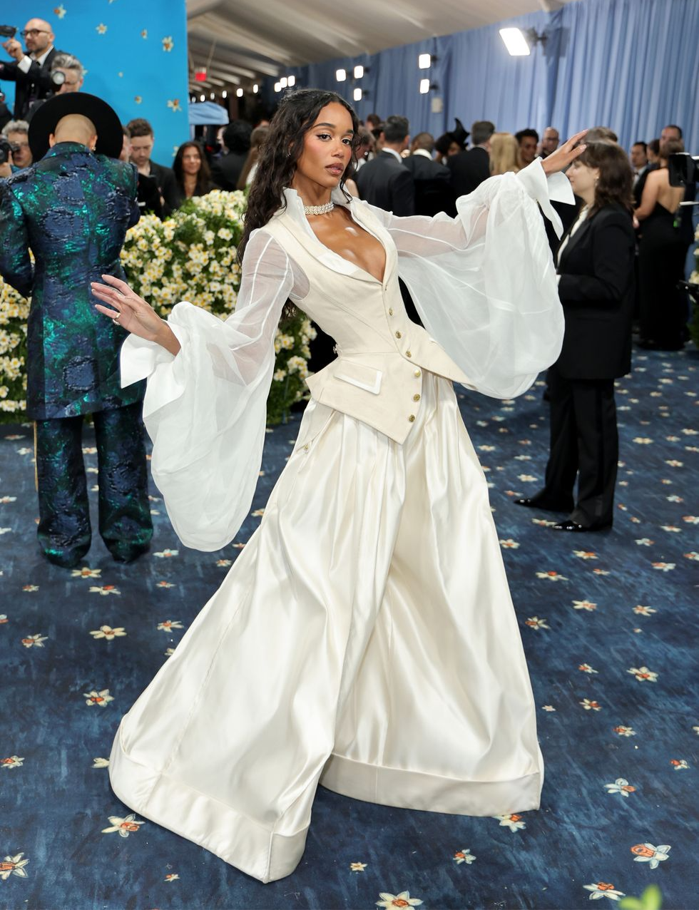Actress Laura Harrier’s outfit provided a more whimsical interpretation of the theme, while the structured cut of her top maintained a sense of tailored elegance.