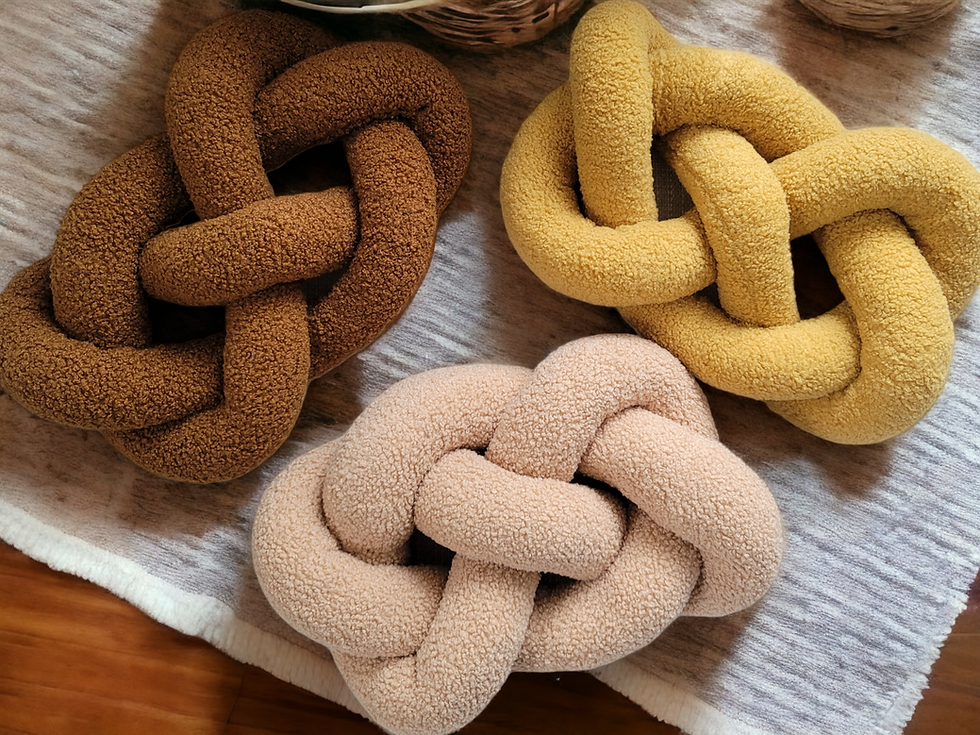 Thumbnail: knot pillow braided in infinity shape has a cozy texture