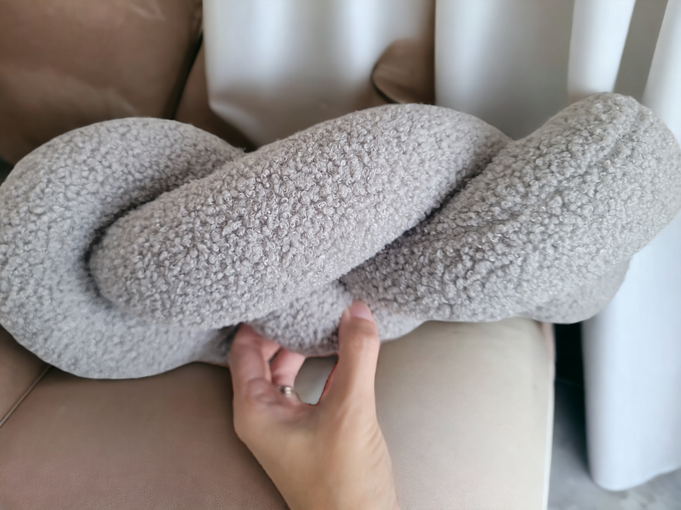 Thumbnail: knot pillow braided in infinity shape has a cozy texture