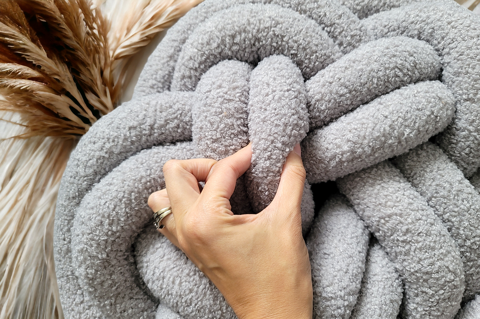 Thumbnail: boucle knot pillow in star shape