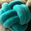 Thumbnail: knot pillow on the beige fabric