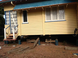 Cottage being relocated on block for renovation & extension