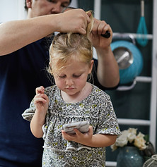 Father Combing Daughter's Hair