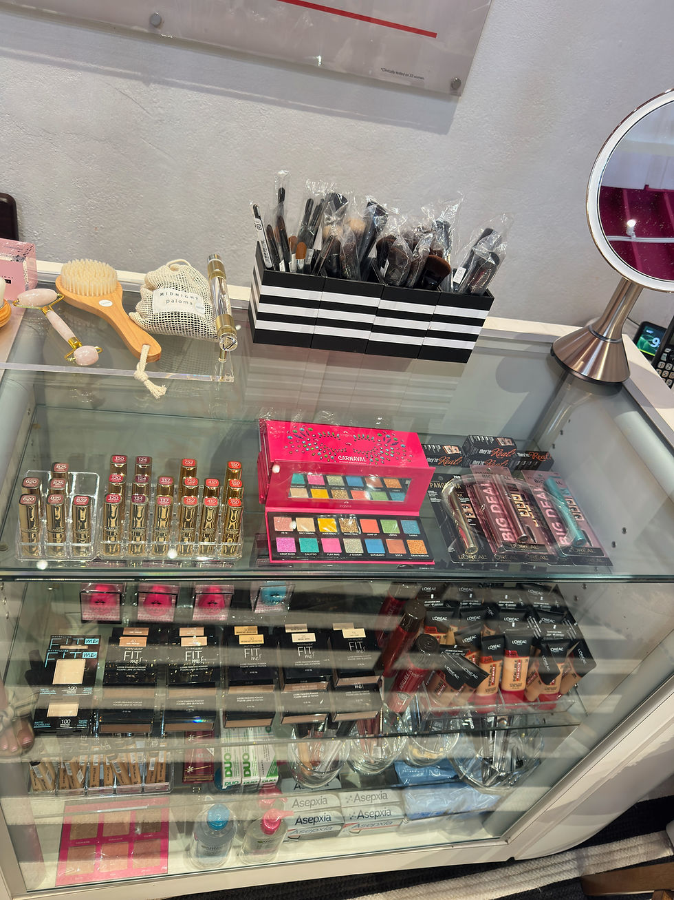 Close-up view of makeup brushes and foundation palette on a vanity table