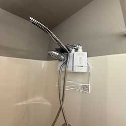 A shower stall with Native brand product