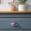 Thumbnail: chrome cup handles have replaced the orignal pine door knobs