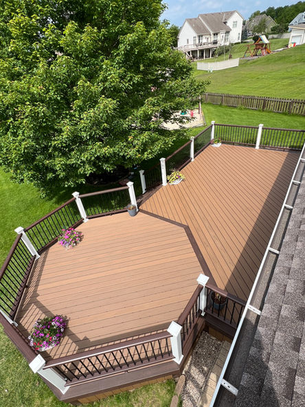 Trex Lineage in Jasper, Picture Framed with Trex Transcend Tropics in Lava Rock. Trex Transcend Railing