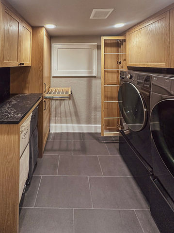 Built in laundry storage shelves and cabinets in Lake Oswego Oregon home