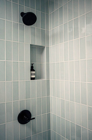 Custom waterproofed tile shower system with frameless glass enclosure built for long term durability in a Lake Oswego bathroom remodel.