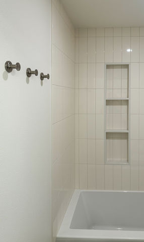 Guest bathroom renovation including new fixtures, tile work, lighting, and ventilation upgrades completed in Lake Oswego.