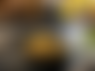 A bowl of Bulgur, Edamame, and Veggies meal. Spring decor. Flowers in a vase.