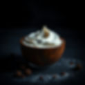 natural face cream in a bowl. dark and moody scene. dynamic and vivid in color.jpg