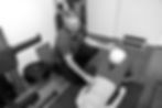 Close-up view of a massage table with essential oils and towels