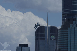 Photo of a ea-13g growler passing the Cbus Super building.

Photo taken during the practice runs for Riverfire 2025.